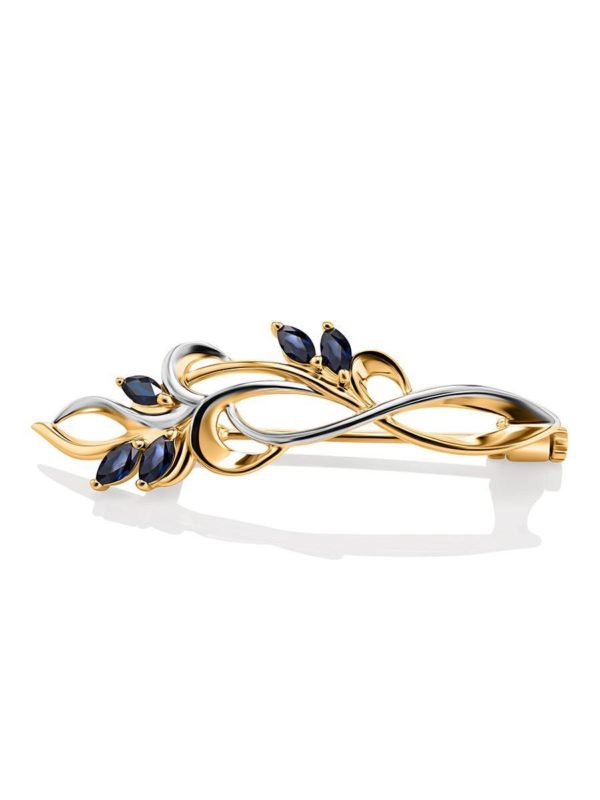 golden brooch with sapphire